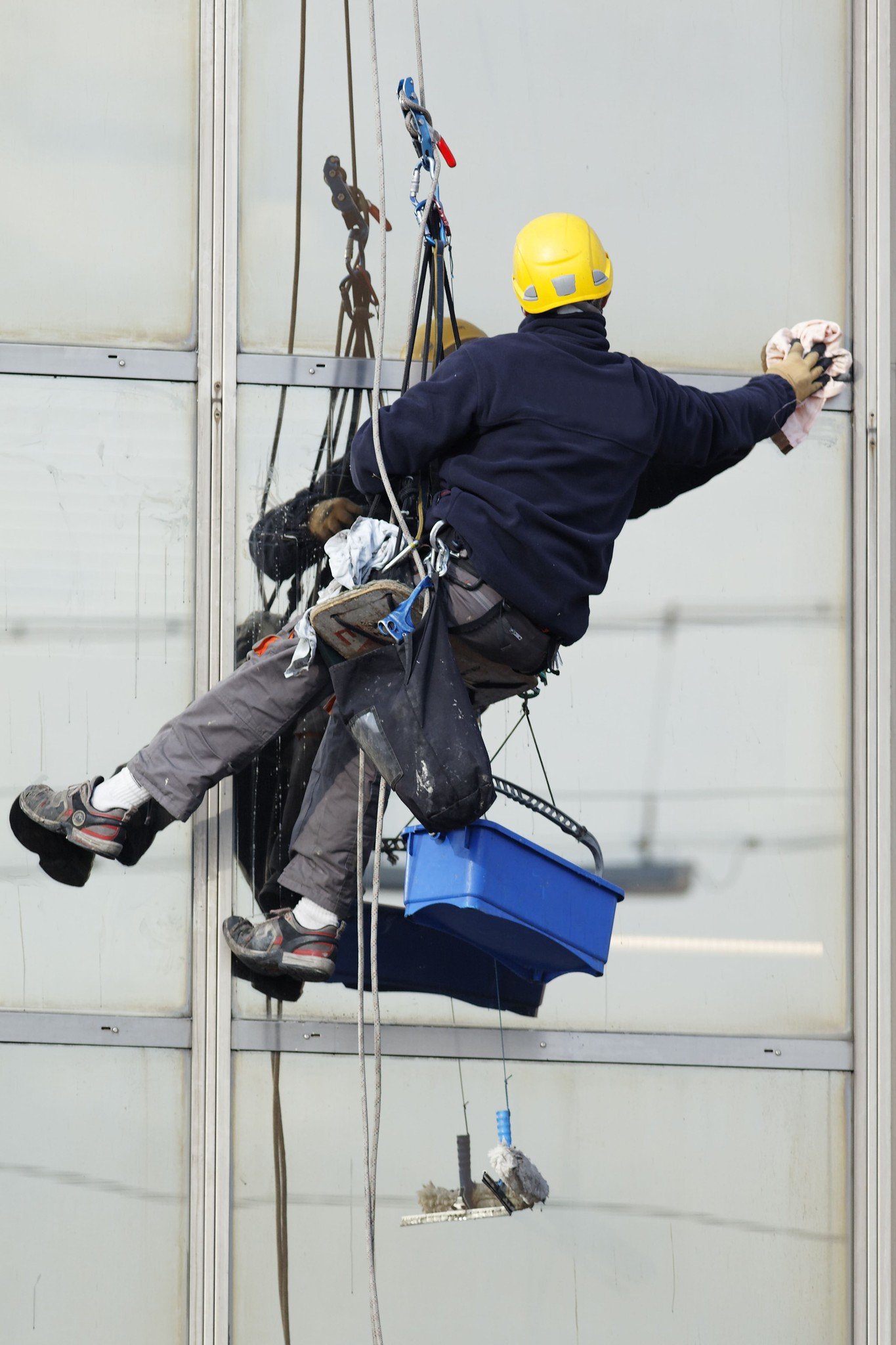 Rope access worker inspecting a building facade
